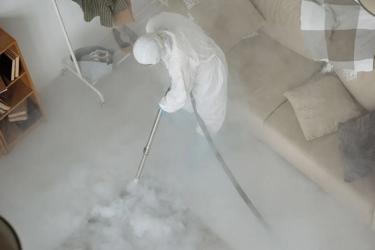 Biohazard cleanup technician in protective equipment, Walker's Point, Milwaukee, WI